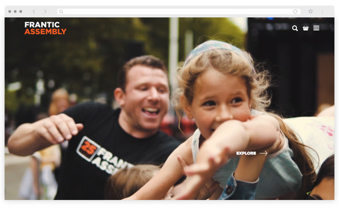 The homepage of Frantic Assembly's new website, shows a still from their 25th birthday celebrations video. A man in a Frantic t-shirt is visible behind a young girl being held aloft with her arms outstretched and a big grin on her face